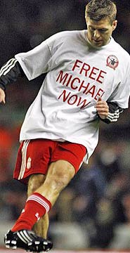 Liverpool captain Steven Gerrard wearing the Free Michael Now T-shirt